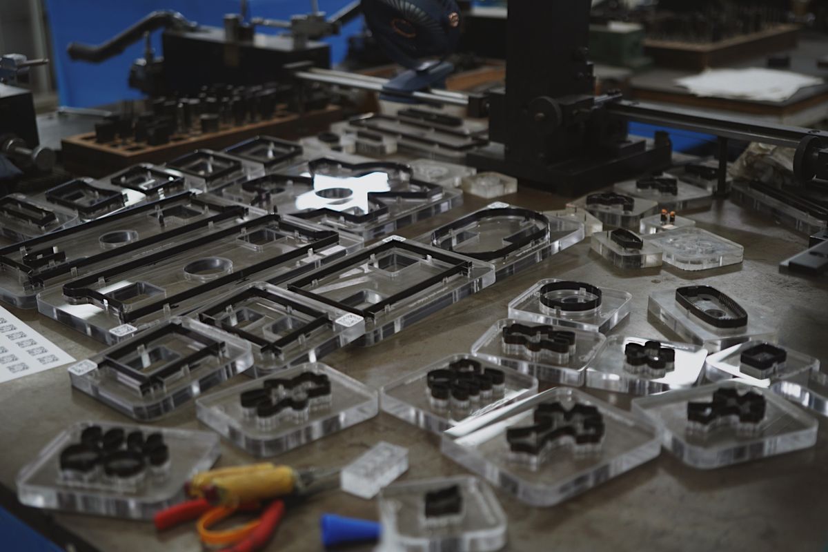 Dies on the workbench, beside our bending machines